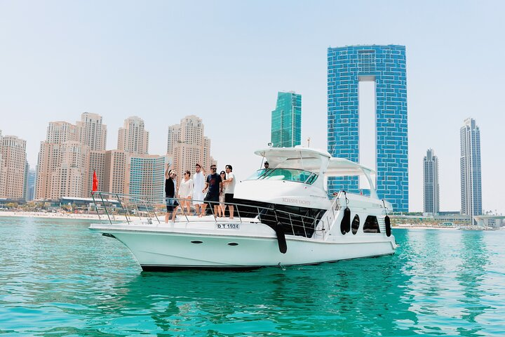Discover Dubai Marina’s stunning skyline from a luxurious yacht offering incredible views of Ain Dubai and JBR while enjoying refreshing drinks on an unforgettable cruise experience.